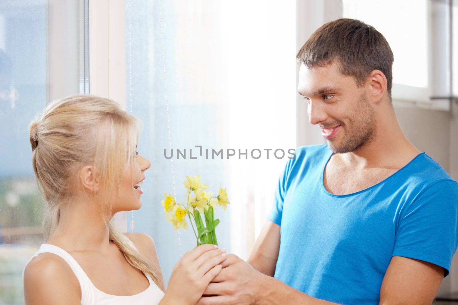 bright picture of happy romantic couple with flowers