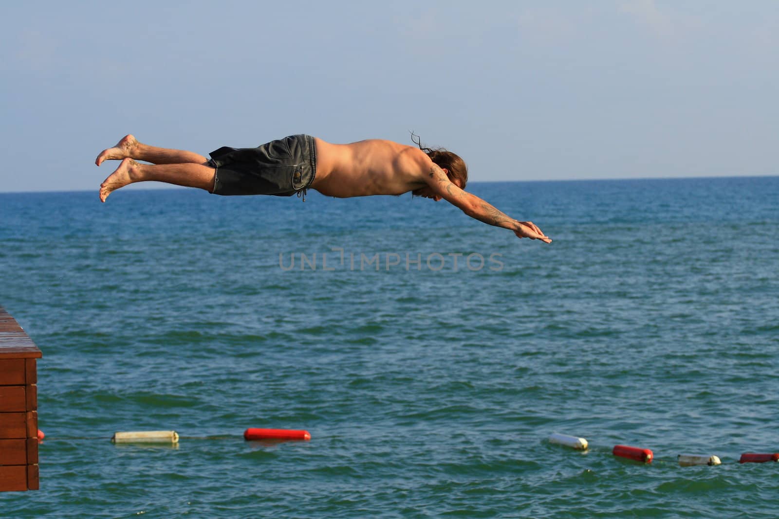 Man jumping into the sea by sergey02