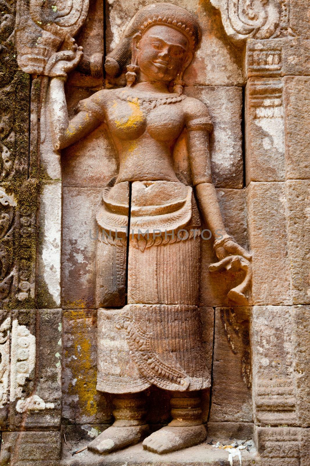 apsara rock carving at the left side of the main door, wat phou, laos