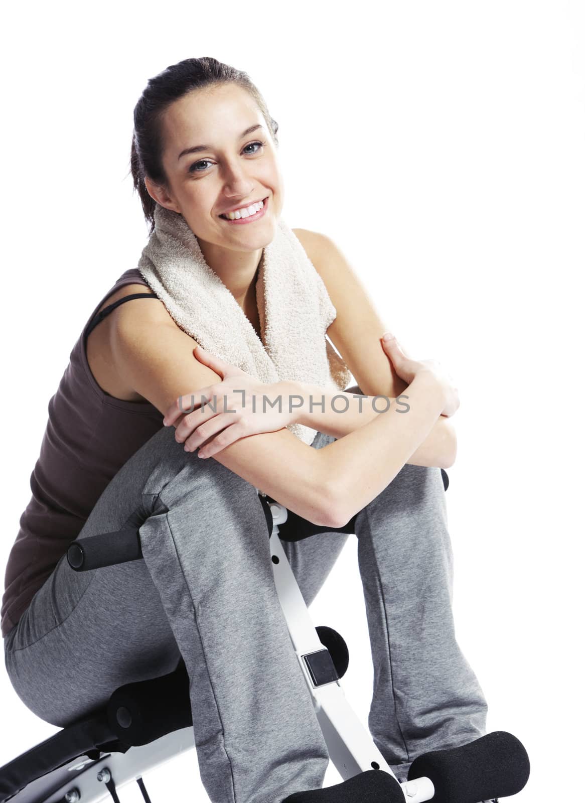 Young Woman In Fitness Clothing Resting After Exercise by stokkete