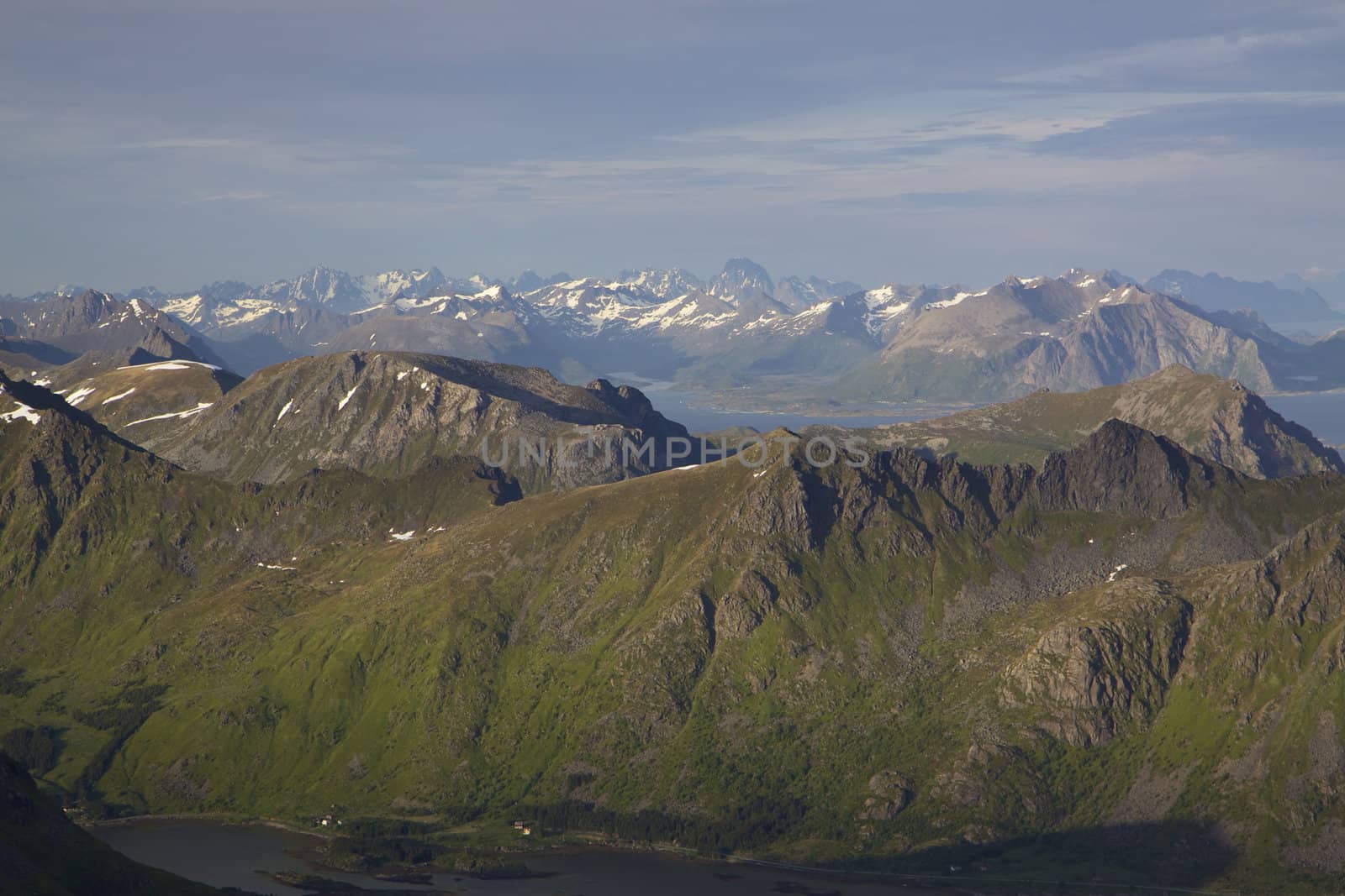 Panoramic view of tallest mountain peaks on Lofoten islands in Norway from Justadtinden