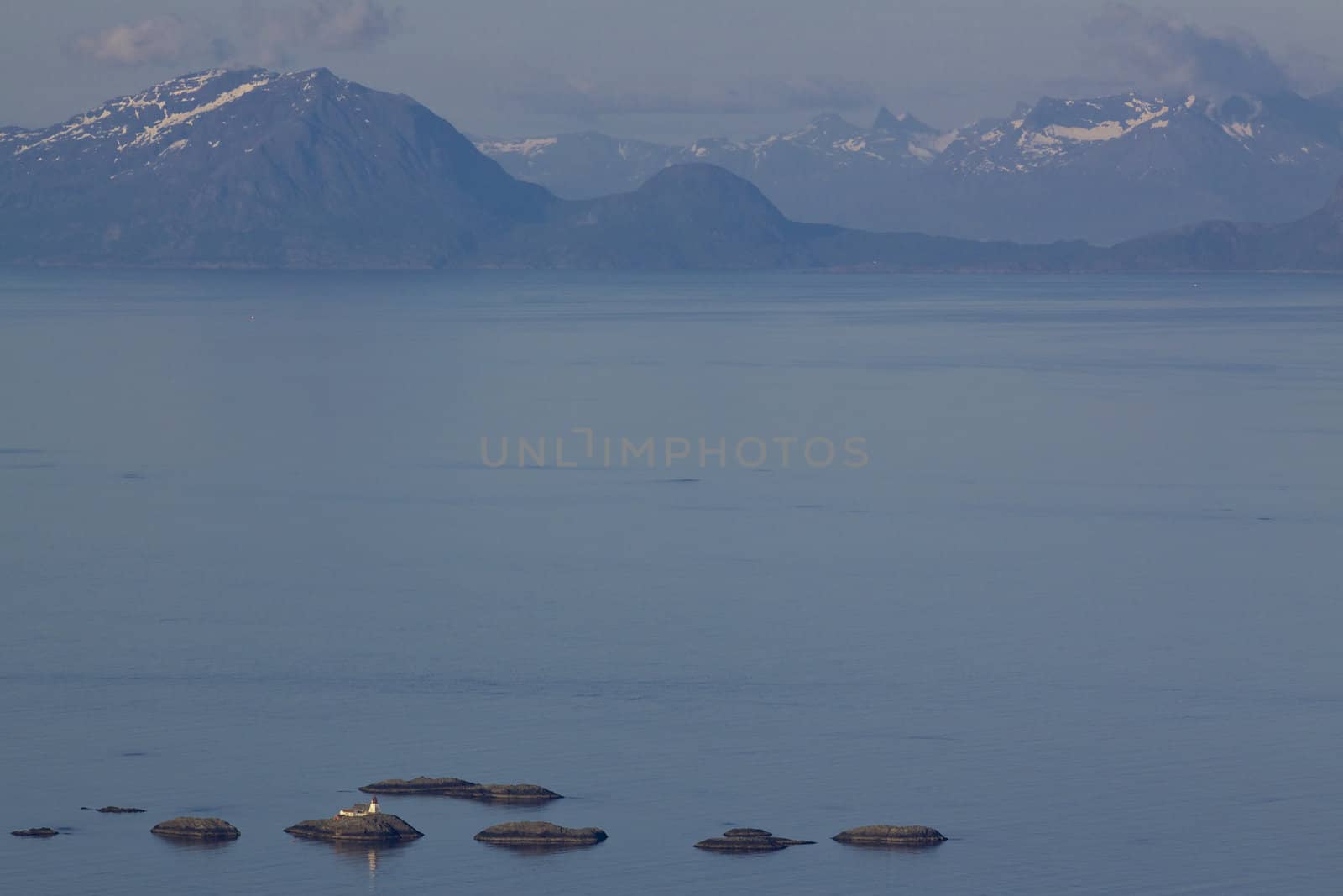 Aerial view of Norwegian sea between Lofoften islands and norwegian mainland dotted with tiny rocky islets