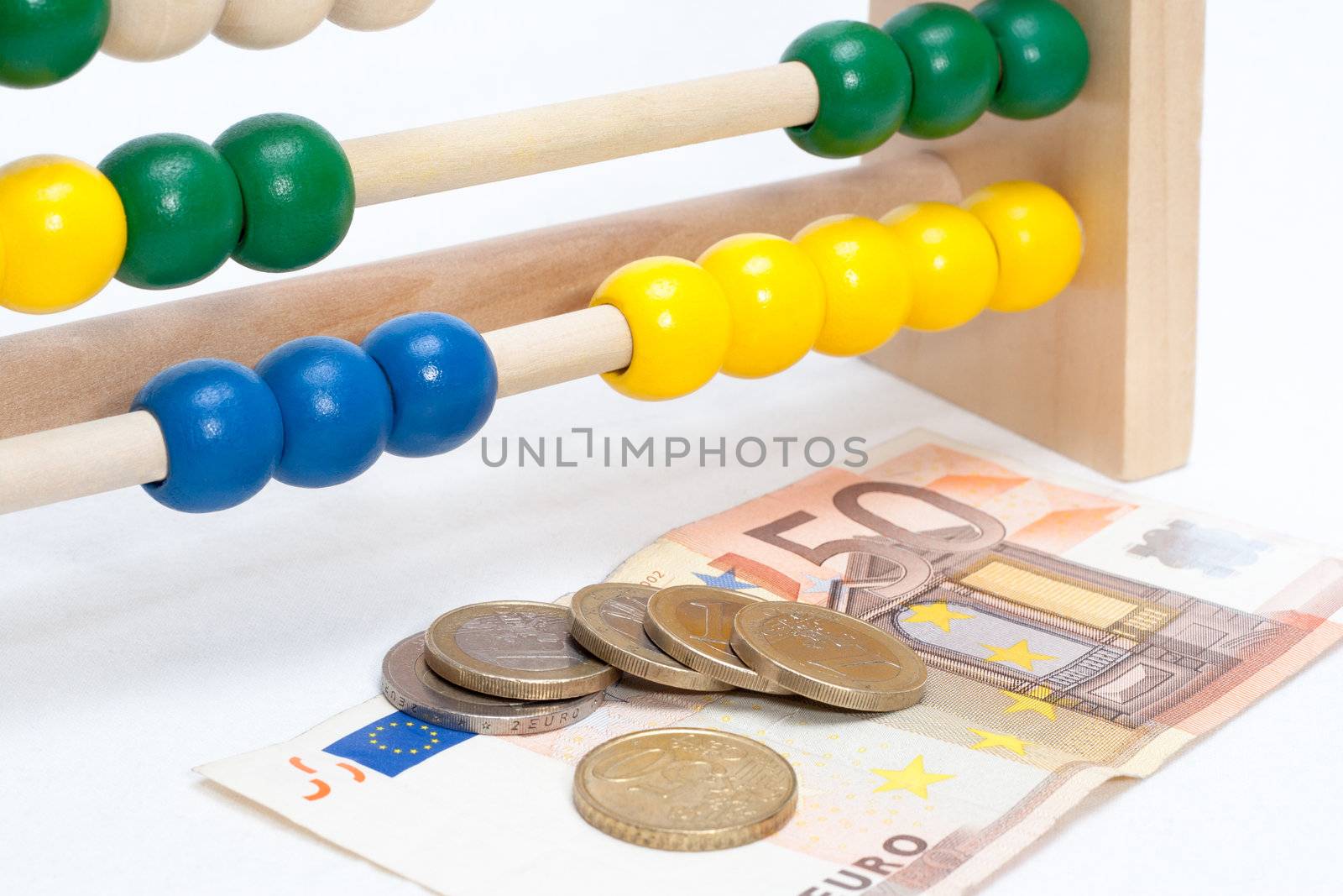 Close up of a colored children sliderule with money