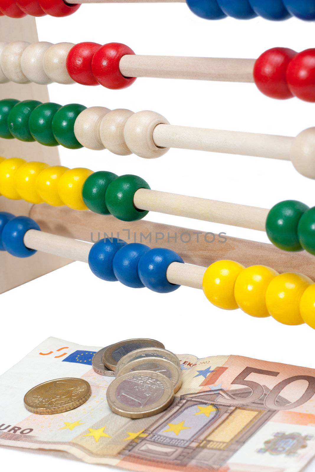 Close up of a colored children sliderule with money