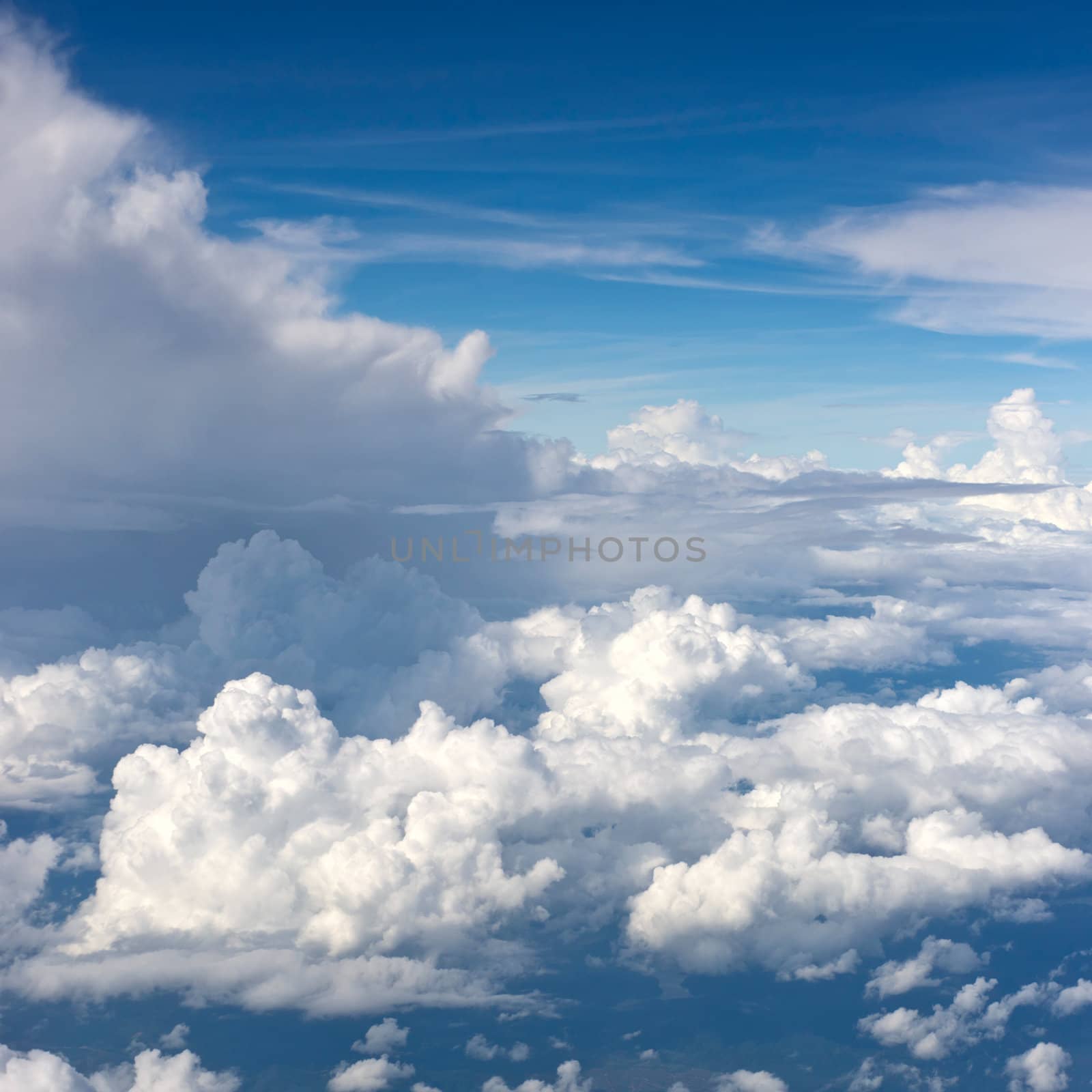 Aerial view on white fluffy clouds