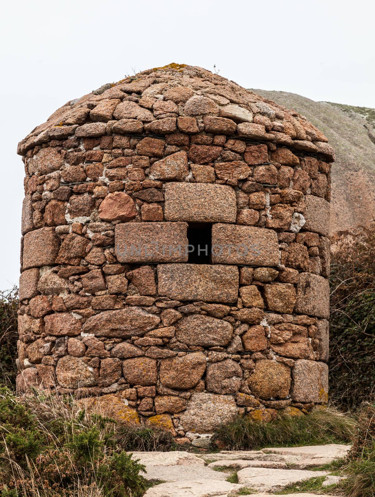 Image of a traditional stone shelter located on the Pink Granite Coast in Brittany in northern France.