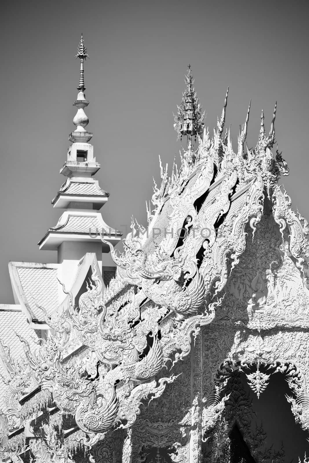 Beautiful white temple Wat Rong Khun.  Wat Rong Khun is a contemporary unconventional Buddhist temple in Chiang Rai, Chiangmai province, Thailand. It is designed in white color.