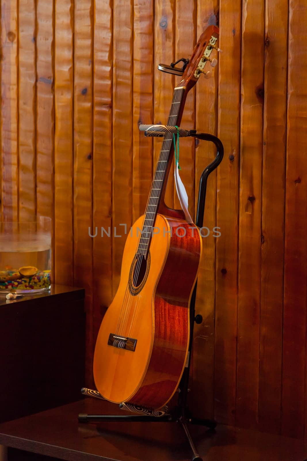 Classic spanish guitar  near of a wood wall