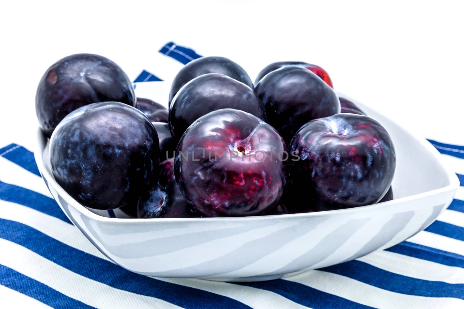 A plums dish on a white background
