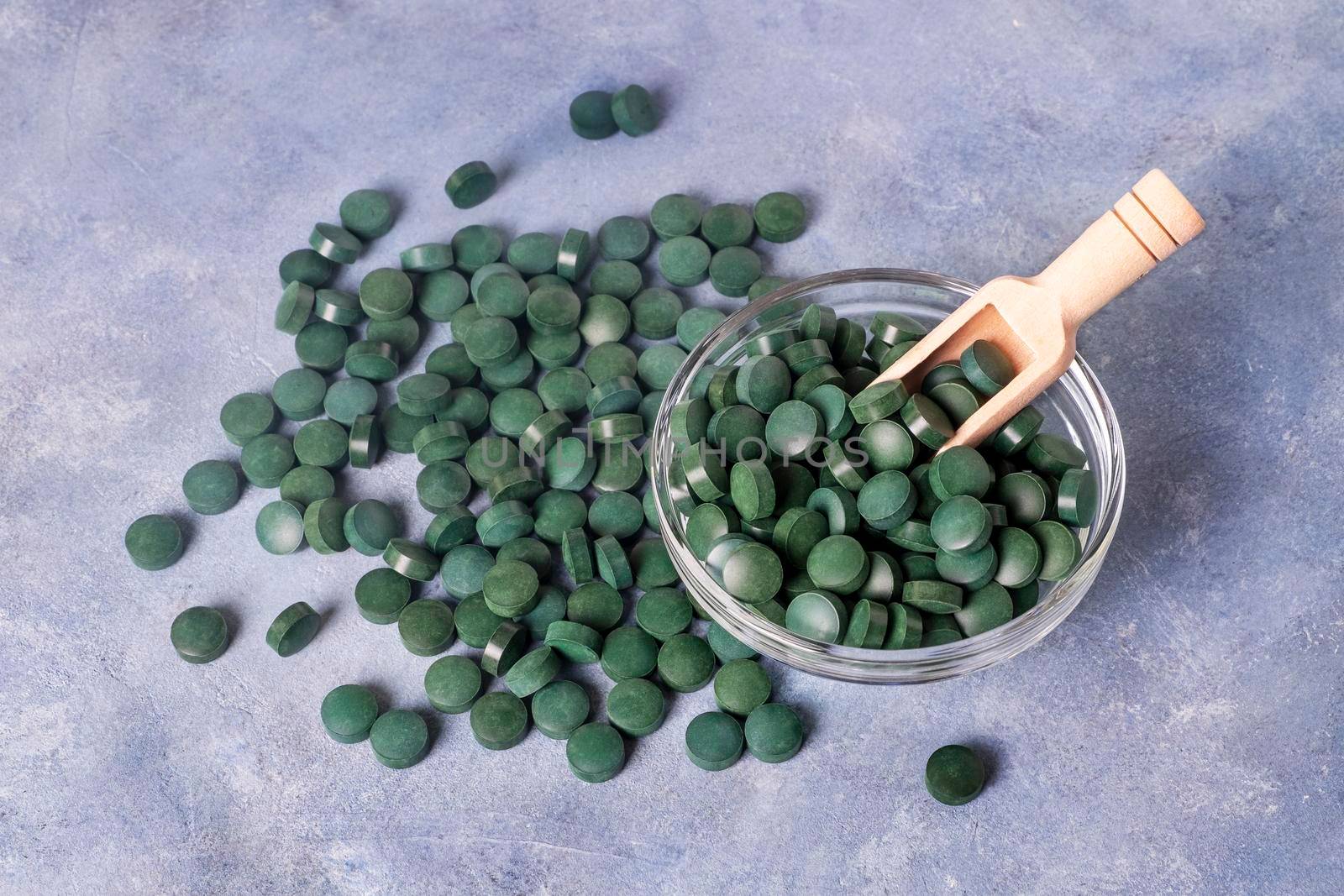 Green pills of spirulina or chlorella by OlgaGubskaya