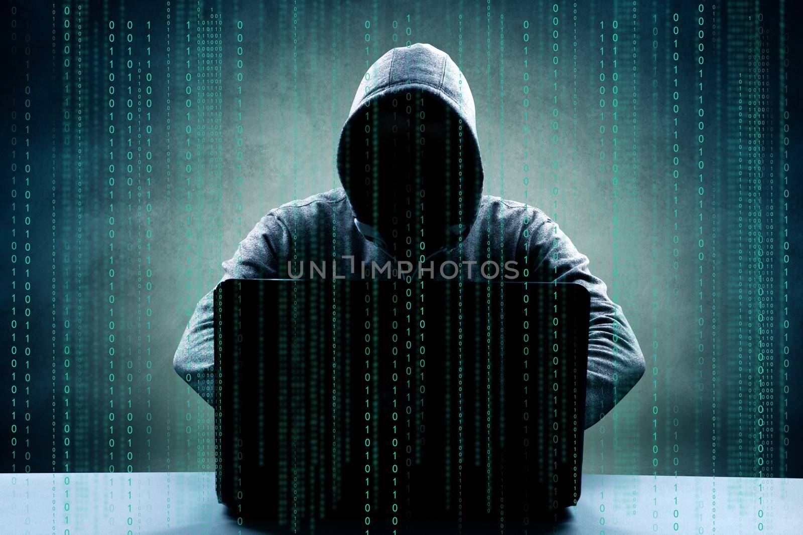 Anonymous internet hacker in front of computer. Web crime concept by Taut