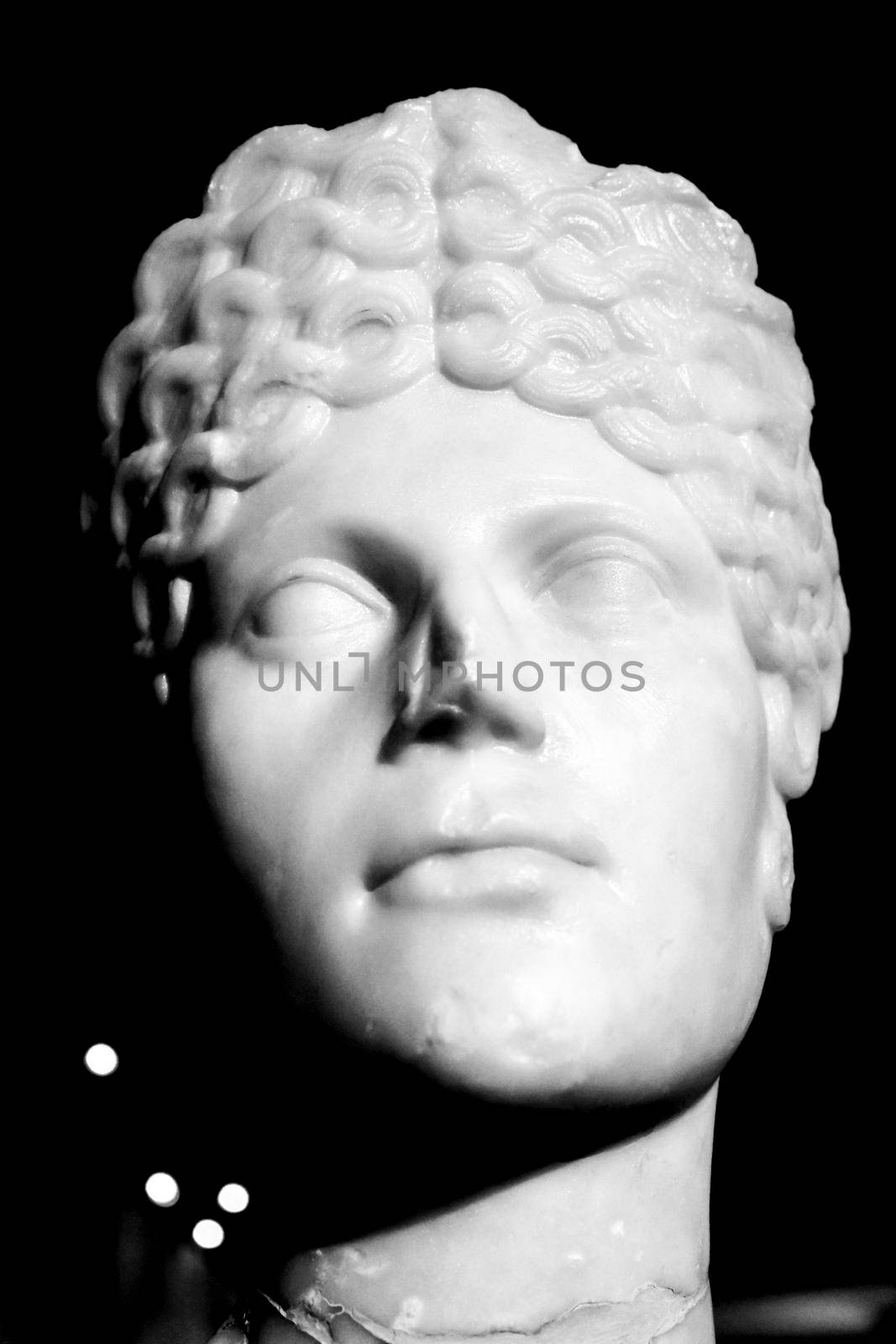 Lisbon, Portugal - May 24, 2018: Face of roman woman carved in marble in the archeological Museum of Lisbon, Portugal