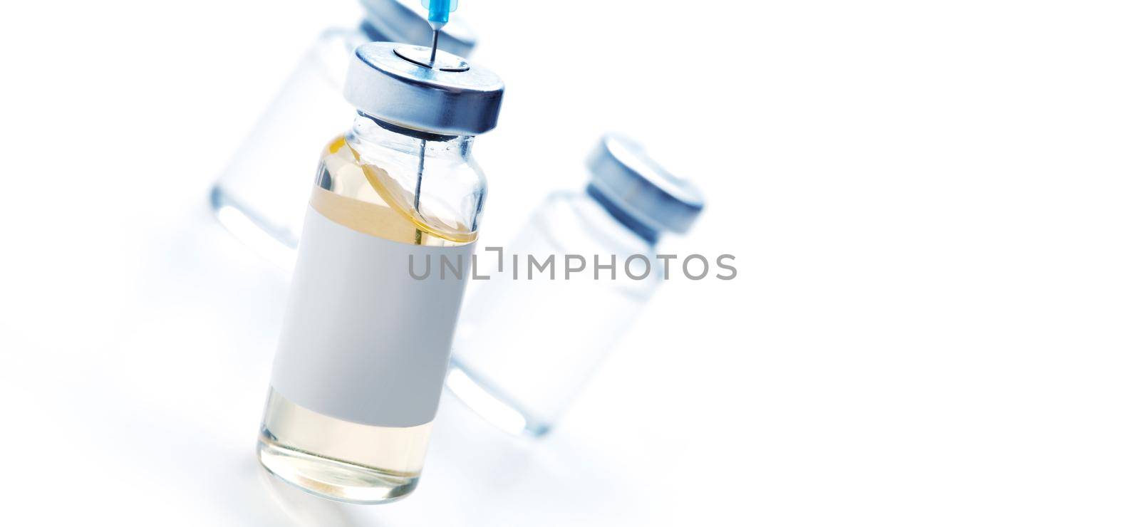Medical syringe with a needle and a bollte with vaccine. by Taut