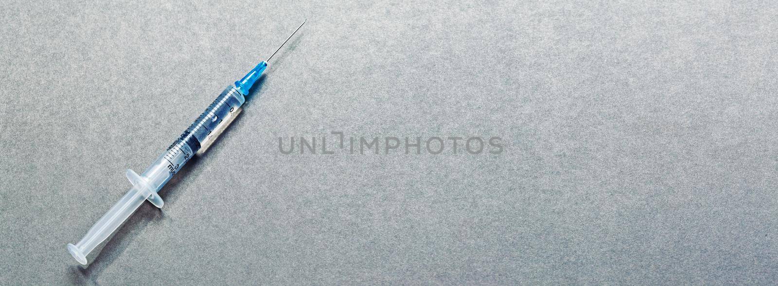 Medical syringe with a needle and vaccine against corona virus. by Taut