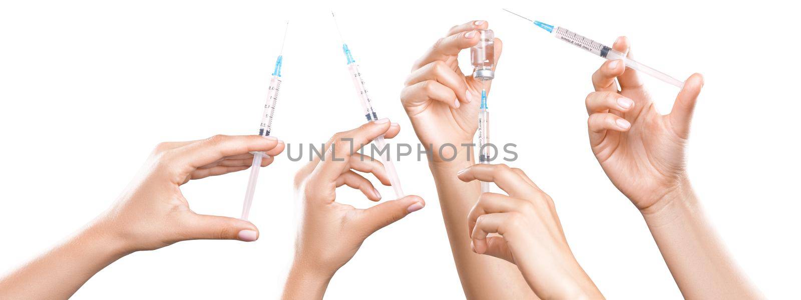 Hand holding syringe with vaccine against corona virus. by Taut