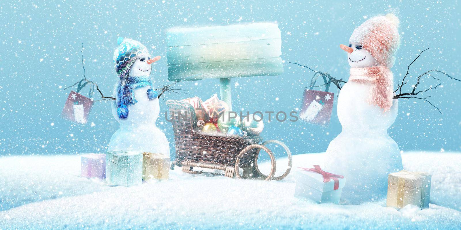 Happy snowman standing in winter christmas landscape.