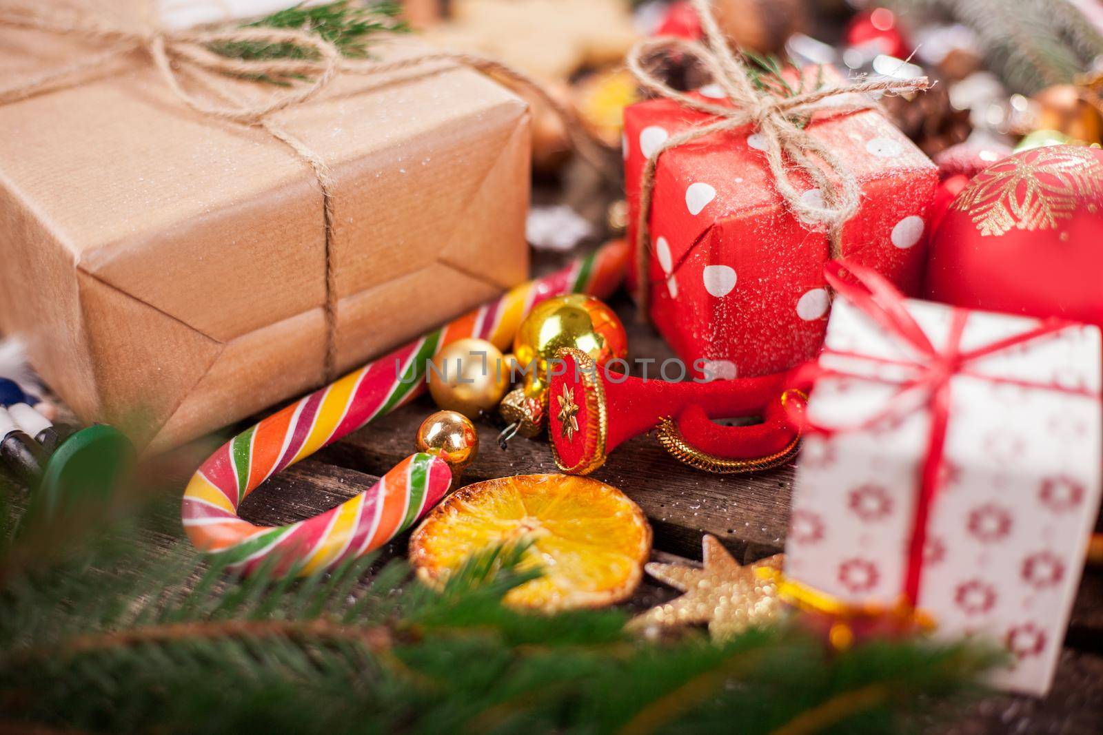 Gift box in wrapping paper with satin ribbon. Merry Christmas holiday concept.
