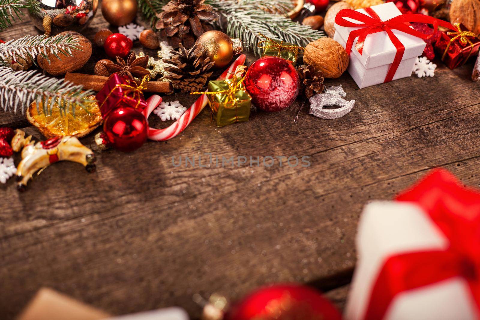 Gift box in wrapping paper with satin ribbon. Merry Christmas holiday concept.
