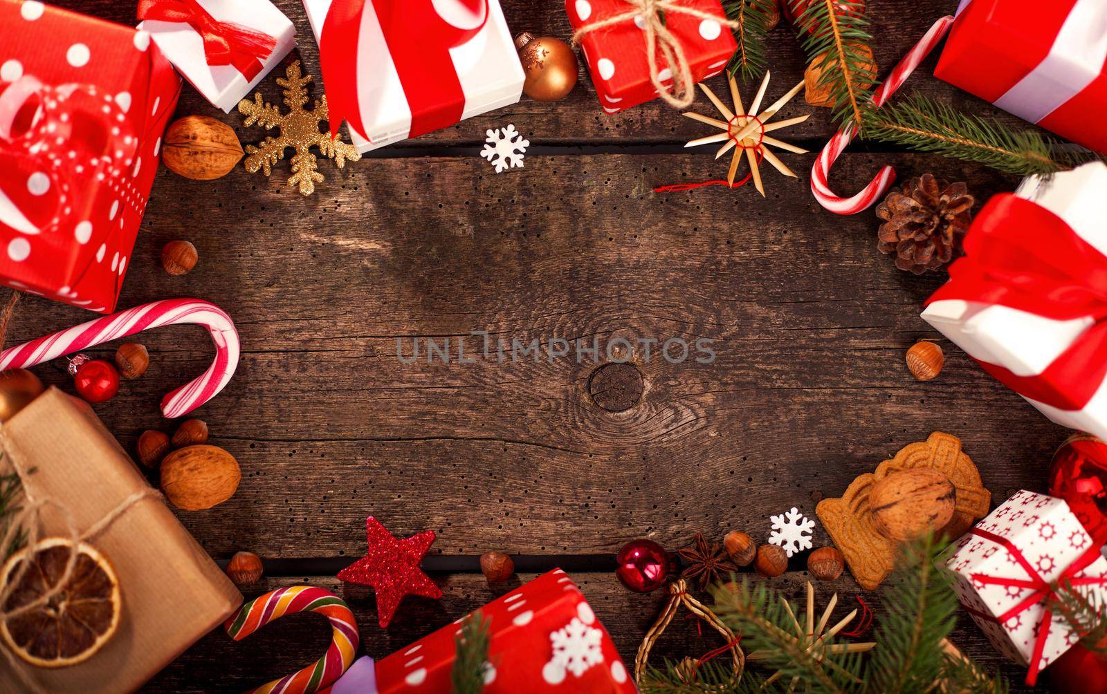 Gift box in wrapping paper with satin ribbon. Merry Christmas holiday concept.