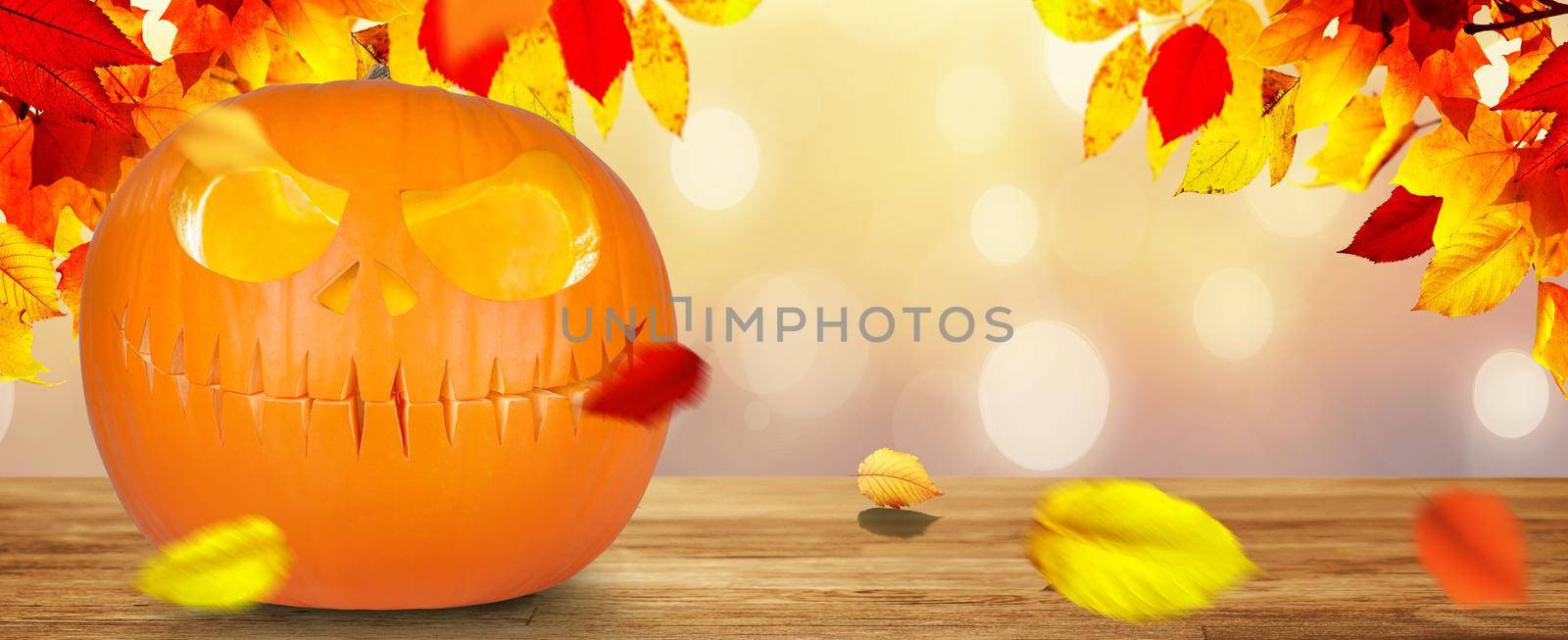 Scary Halloween pumpkin with eyes glowing inside on wooden background by Taut