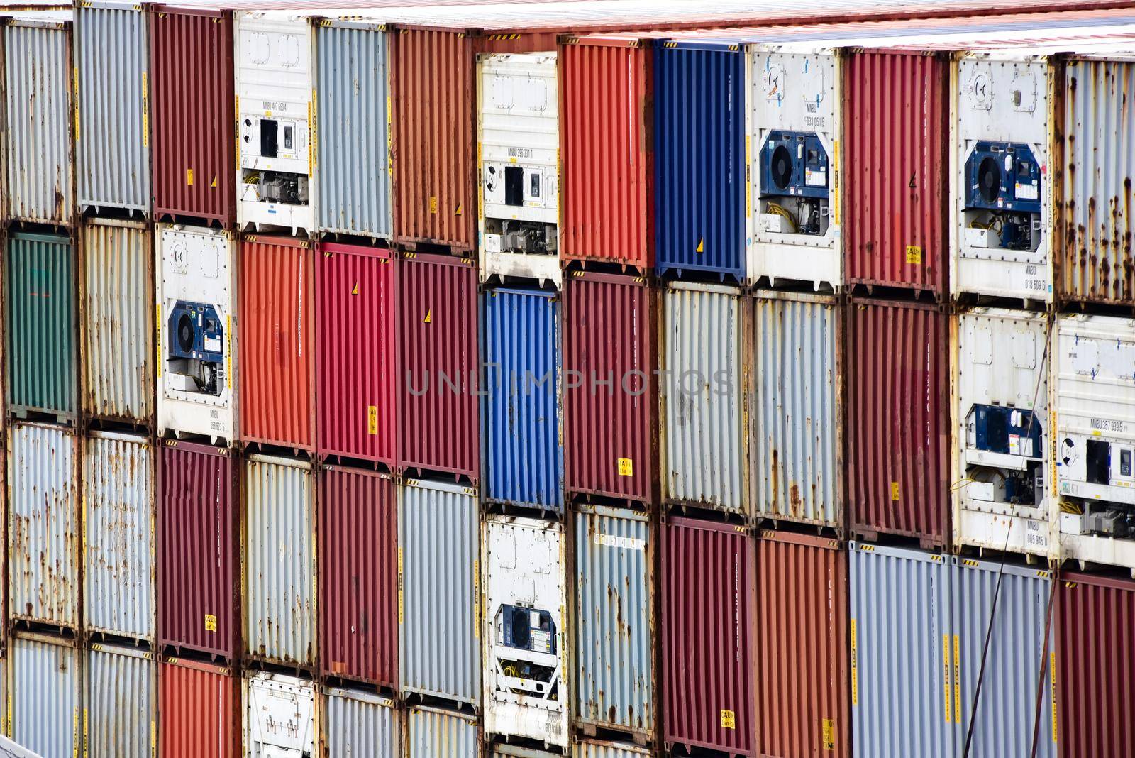 Freight shipping. Dozens of cargo containers stacked in a shipping yard.