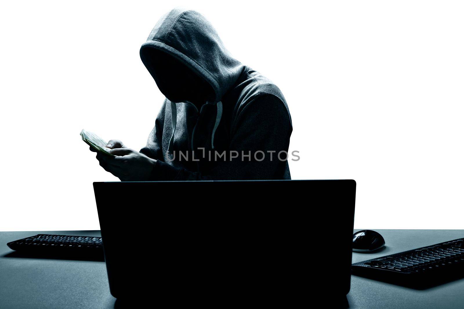 Anonymous internet hacker in front of computer. Web crime concept by Taut