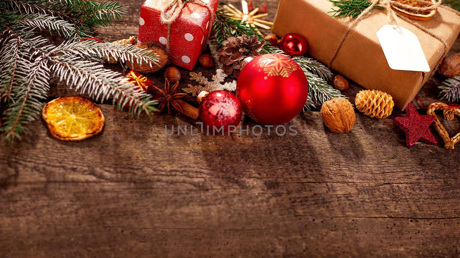 Gift box in wrapping paper with satin ribbon. Merry Christmas holiday concept.
