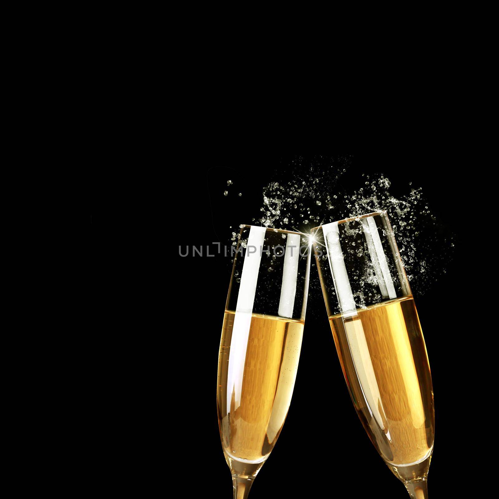 Glasses of champagne with splash, celebration theme concept