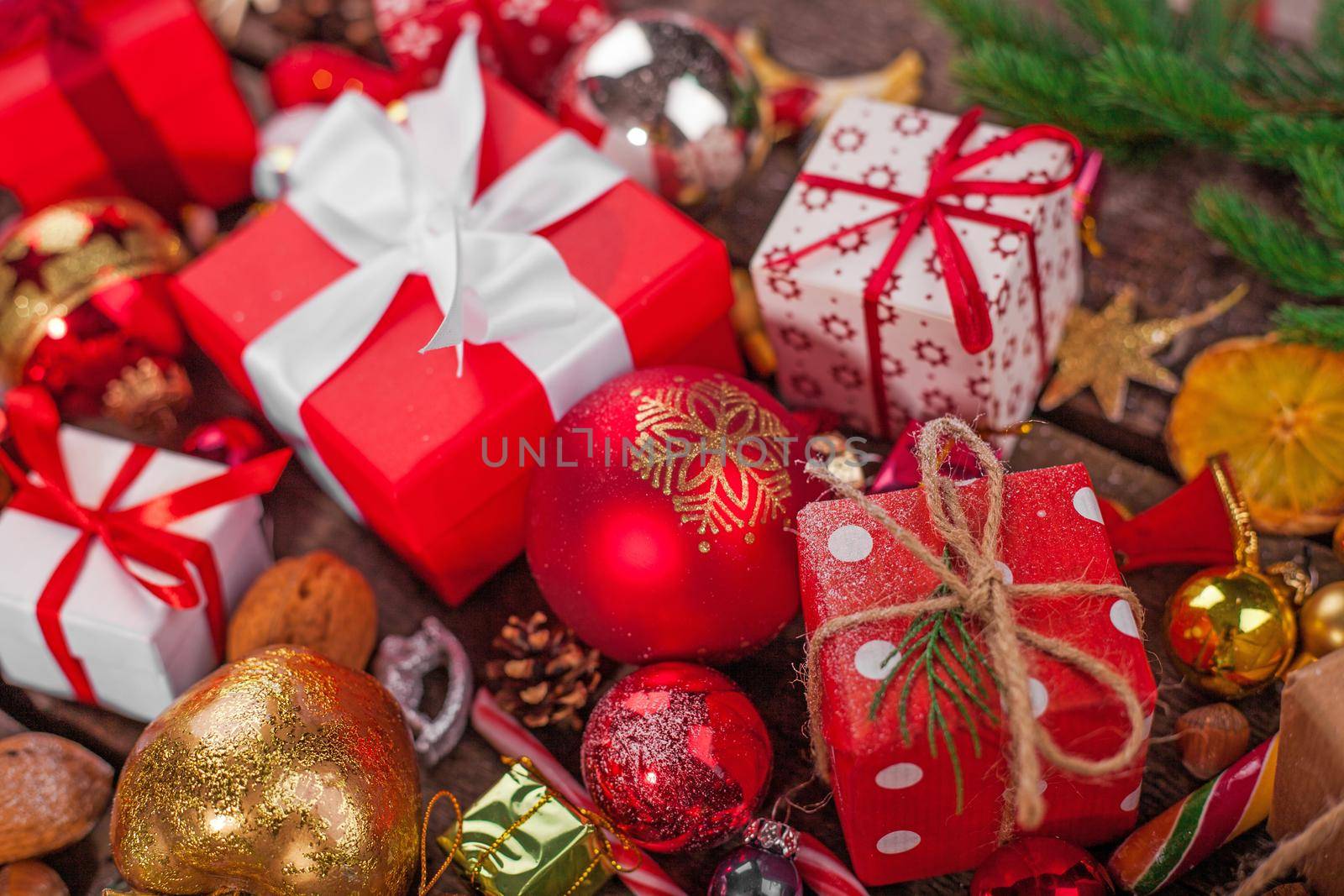Gift box in wrapping paper with satin ribbon. Merry Christmas holiday concept.