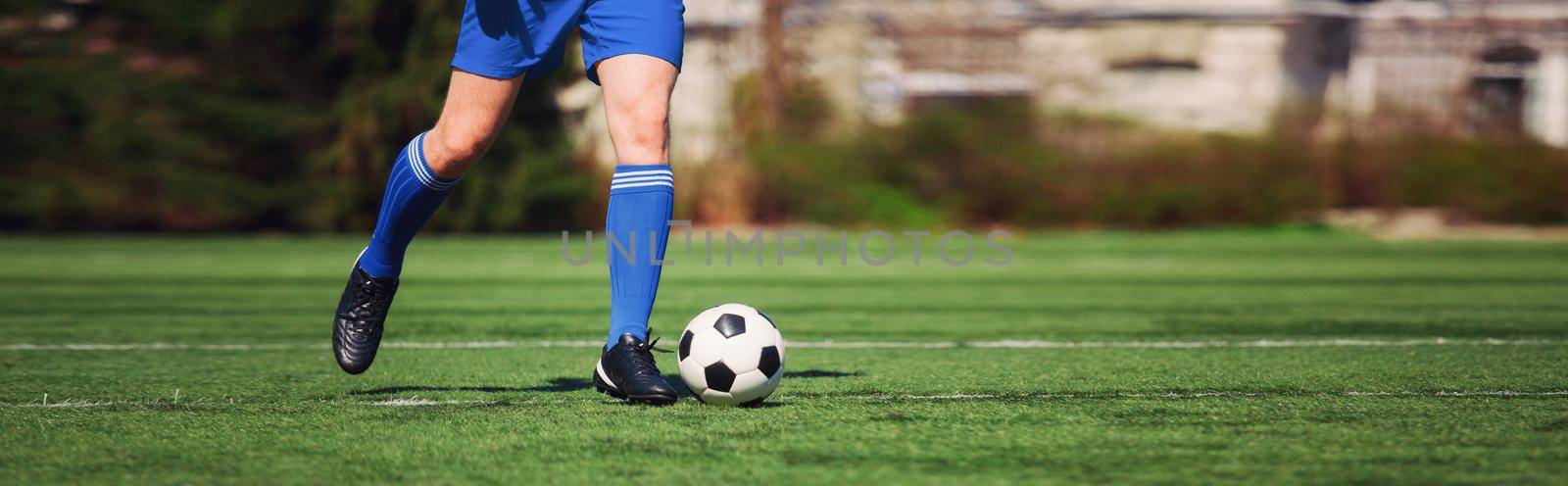 Soccer ball on green playground. Soccer concept by Taut