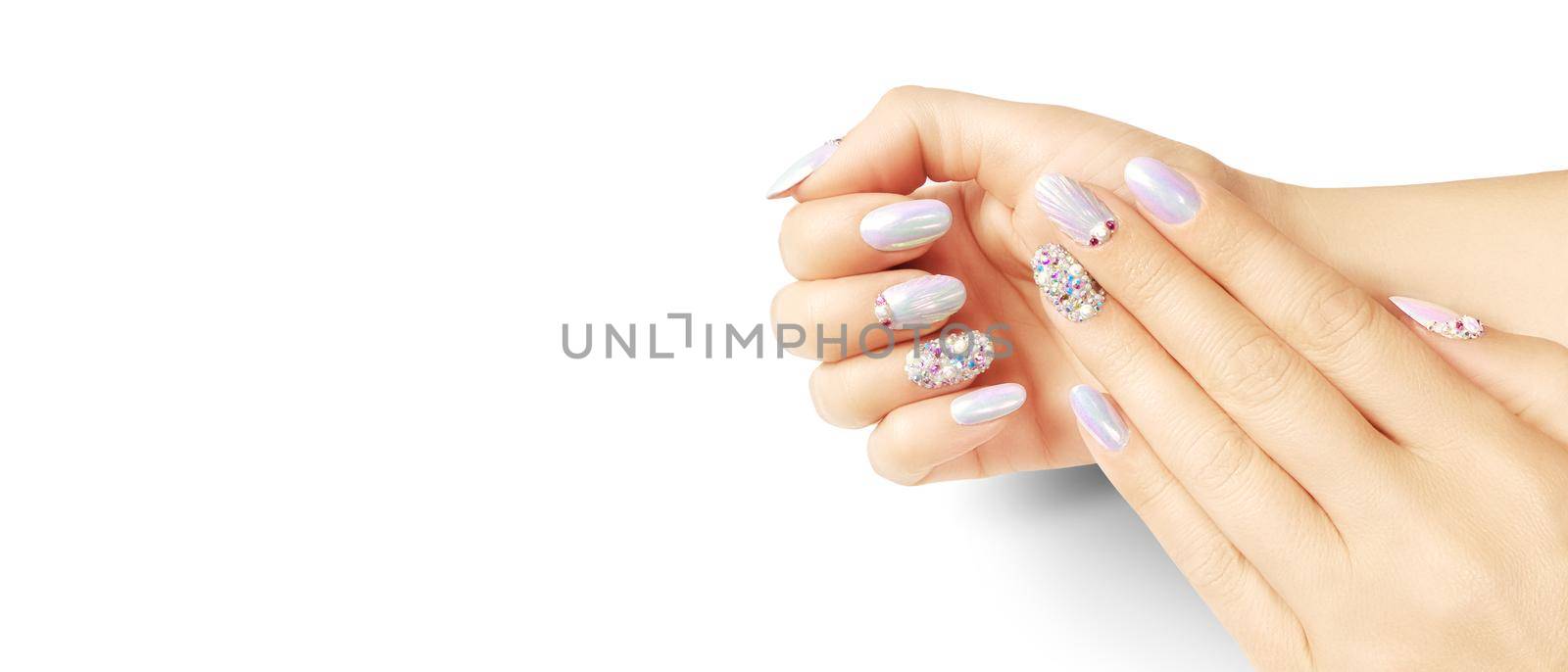 Summer fashion and beauty hand care concept with seashells by Taut