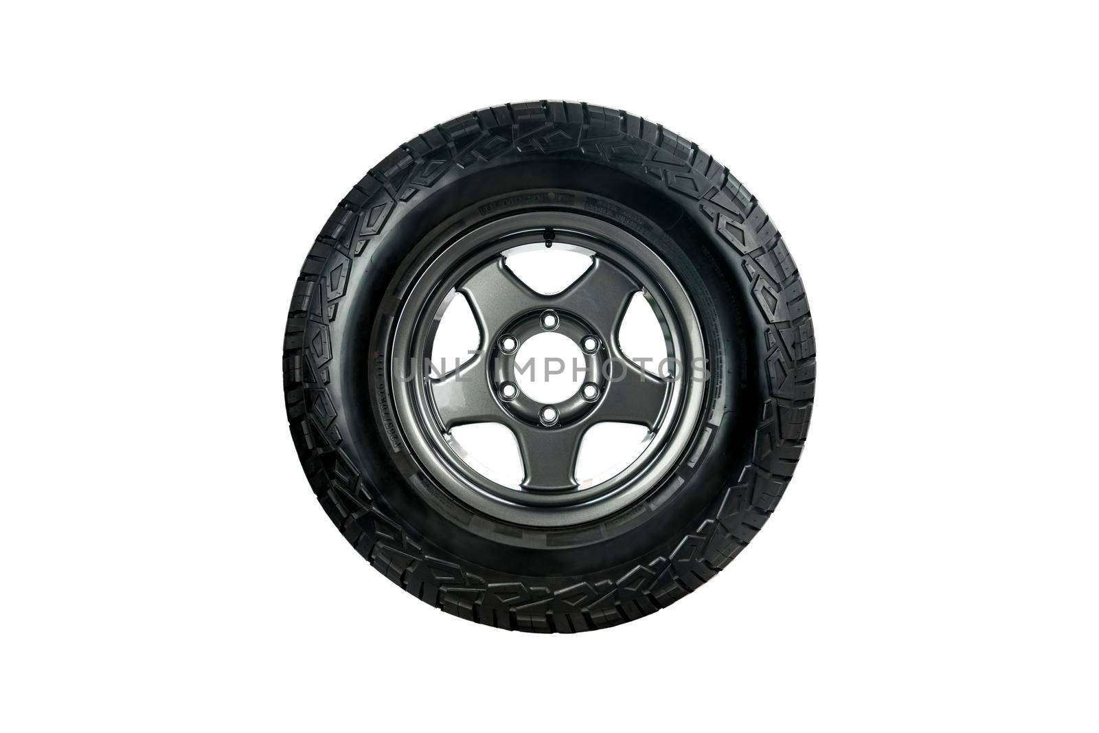 All terrain tire designed for use in all road conditions with alloy wheel isolated on white background. by wattanaphob