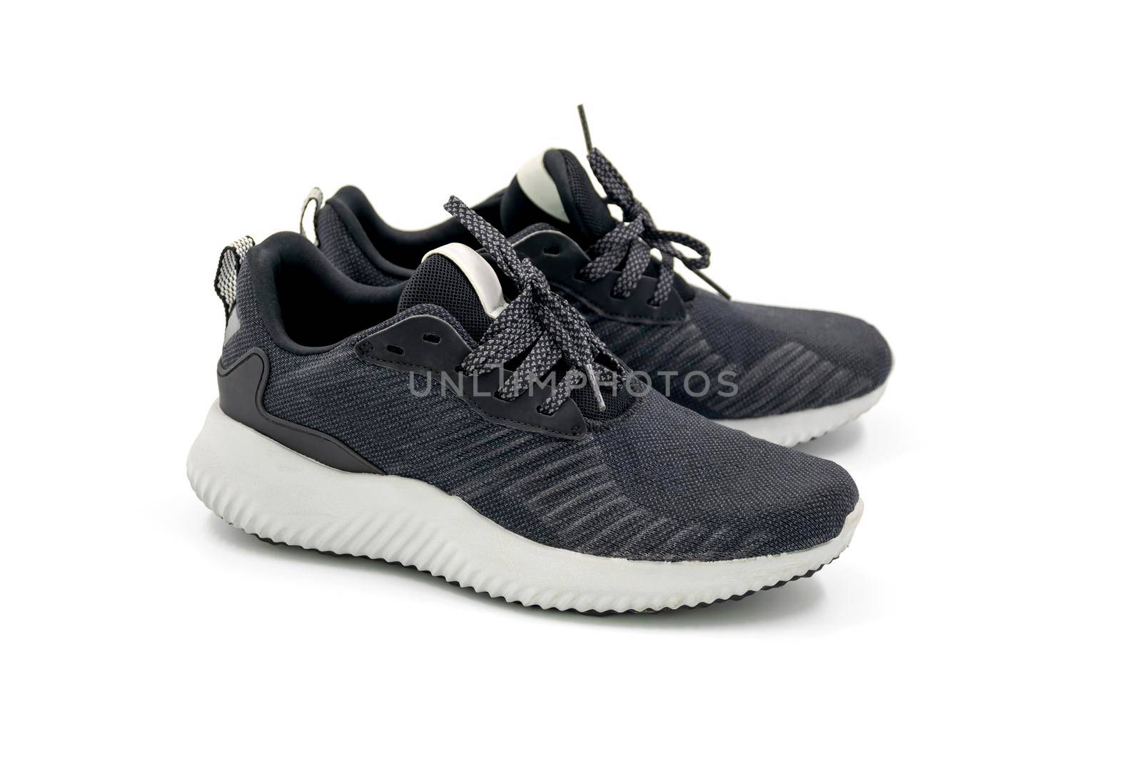 Black color fashion sport shoes isolated on white background.