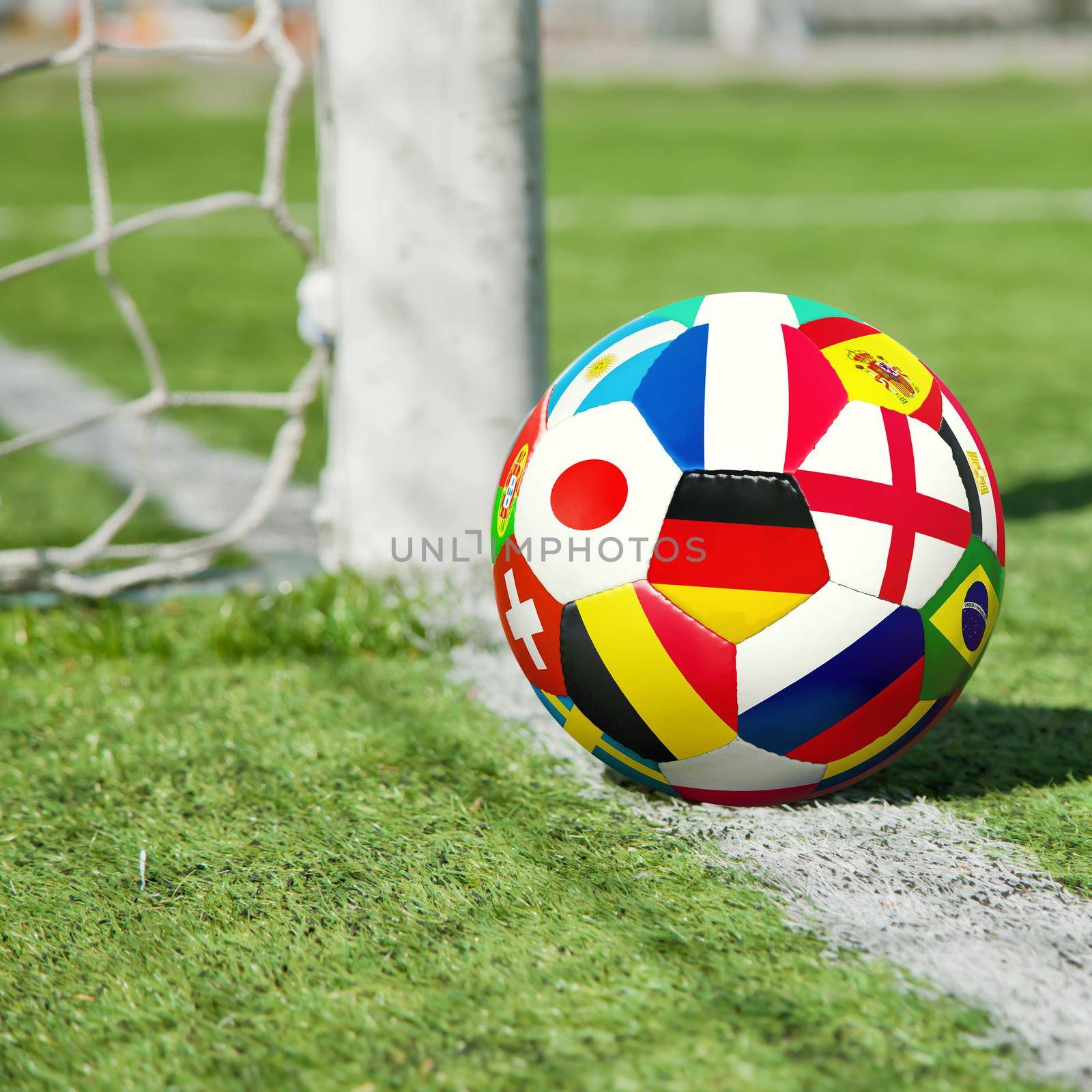 Soccer ball in the net of a goal. Soccer concept by Taut