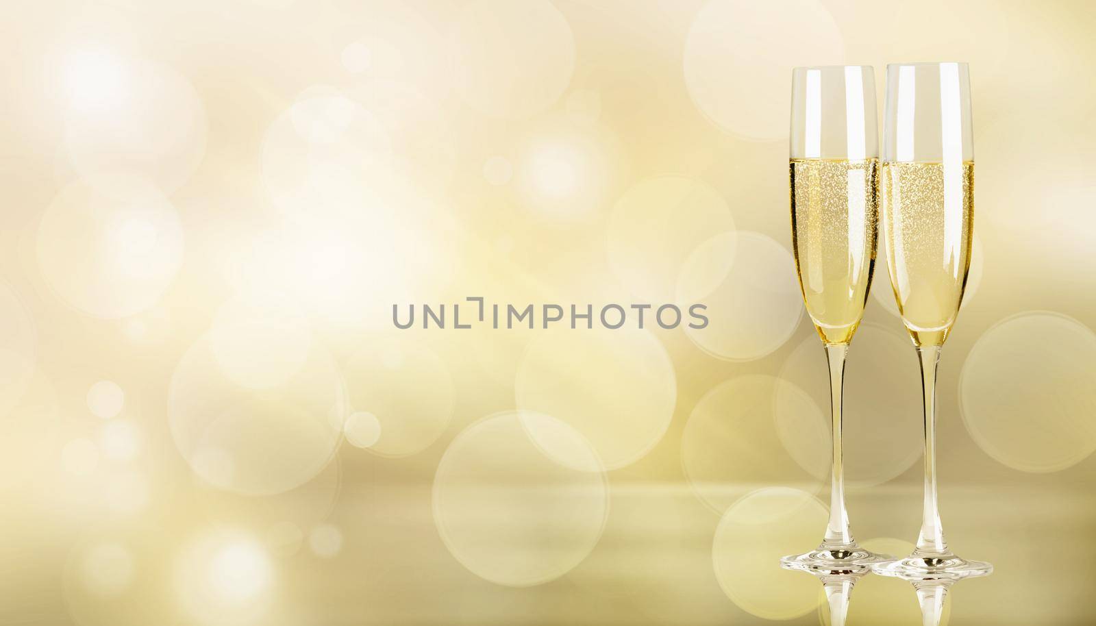 Glasses of champagne with splash, celebration theme concept