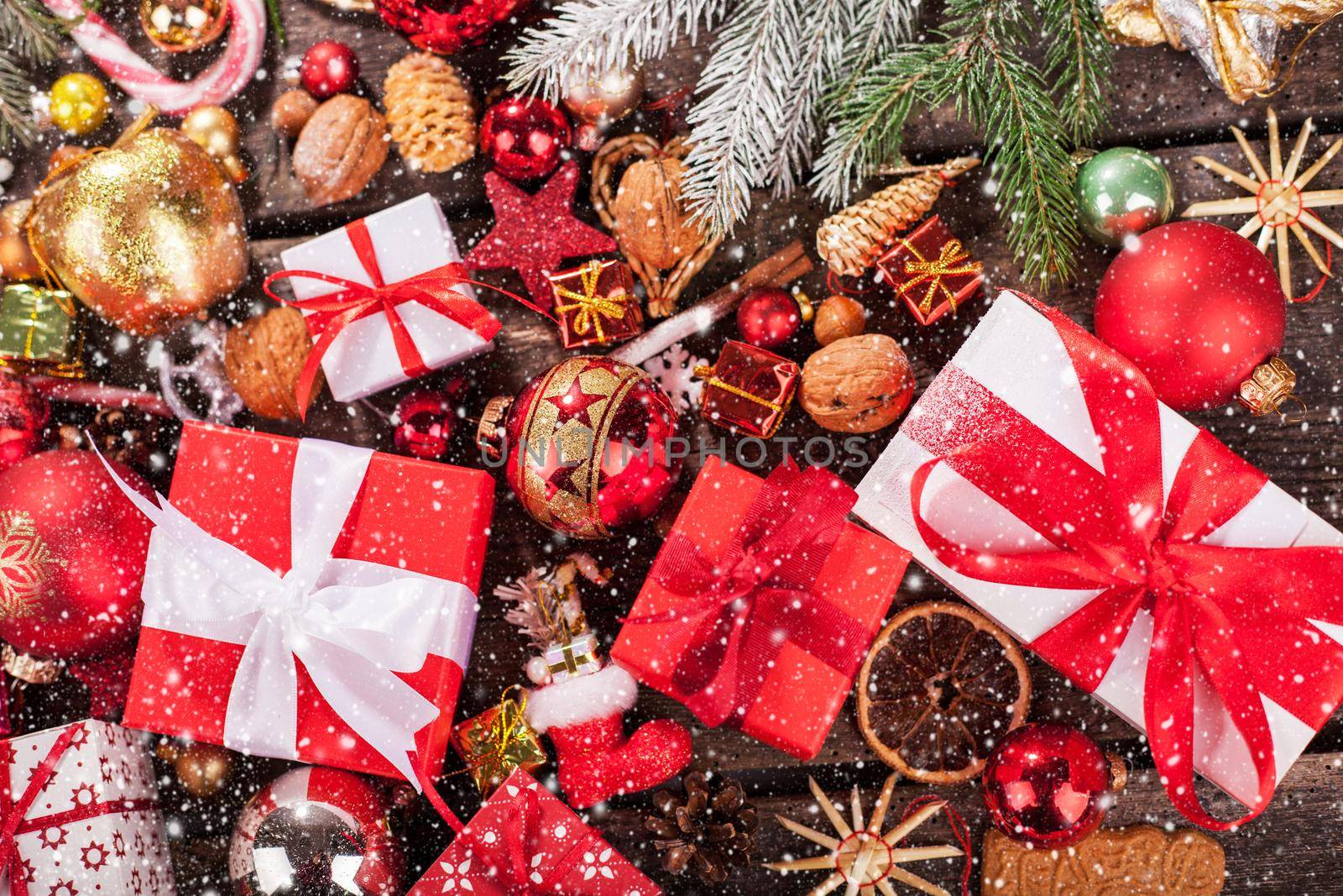 Gift box in wrapping paper with satin ribbon. Merry Christmas holiday concept.