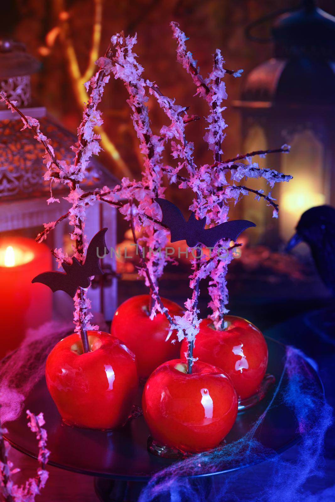 Halloween dessert. Poisoned blood caramelized glazed candy apple. Snow White Poison Lollipops. 