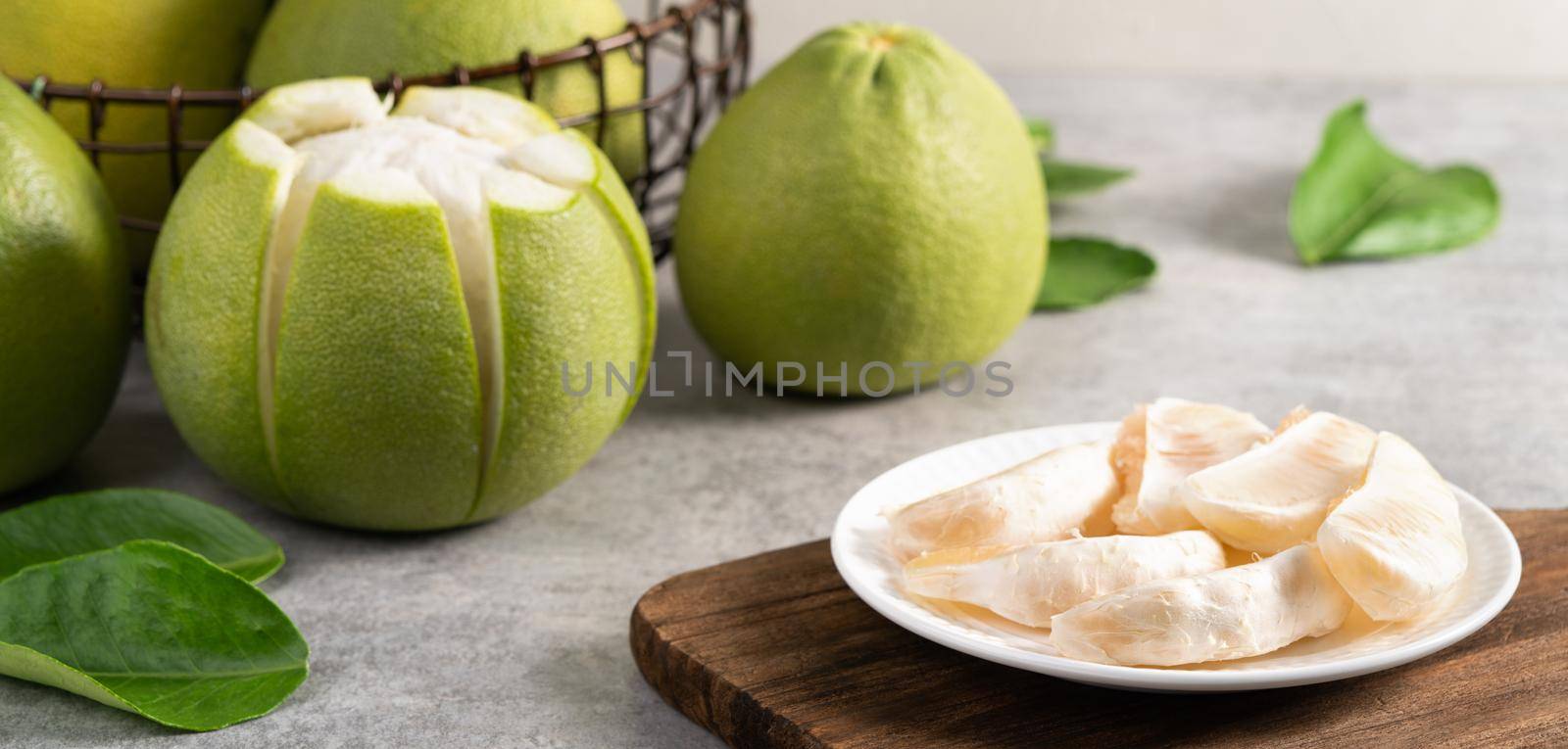 Fresh pomelo on gray cement background for Mid-Autumn Festival fruit.