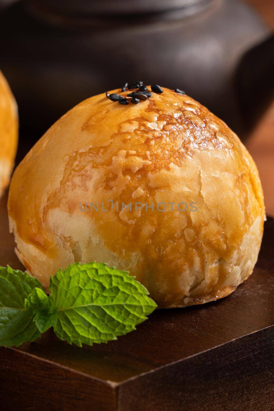 Close up of Moon cake yolk pastry, mooncake for Mid-Autumn Festival holiday on wooden table background