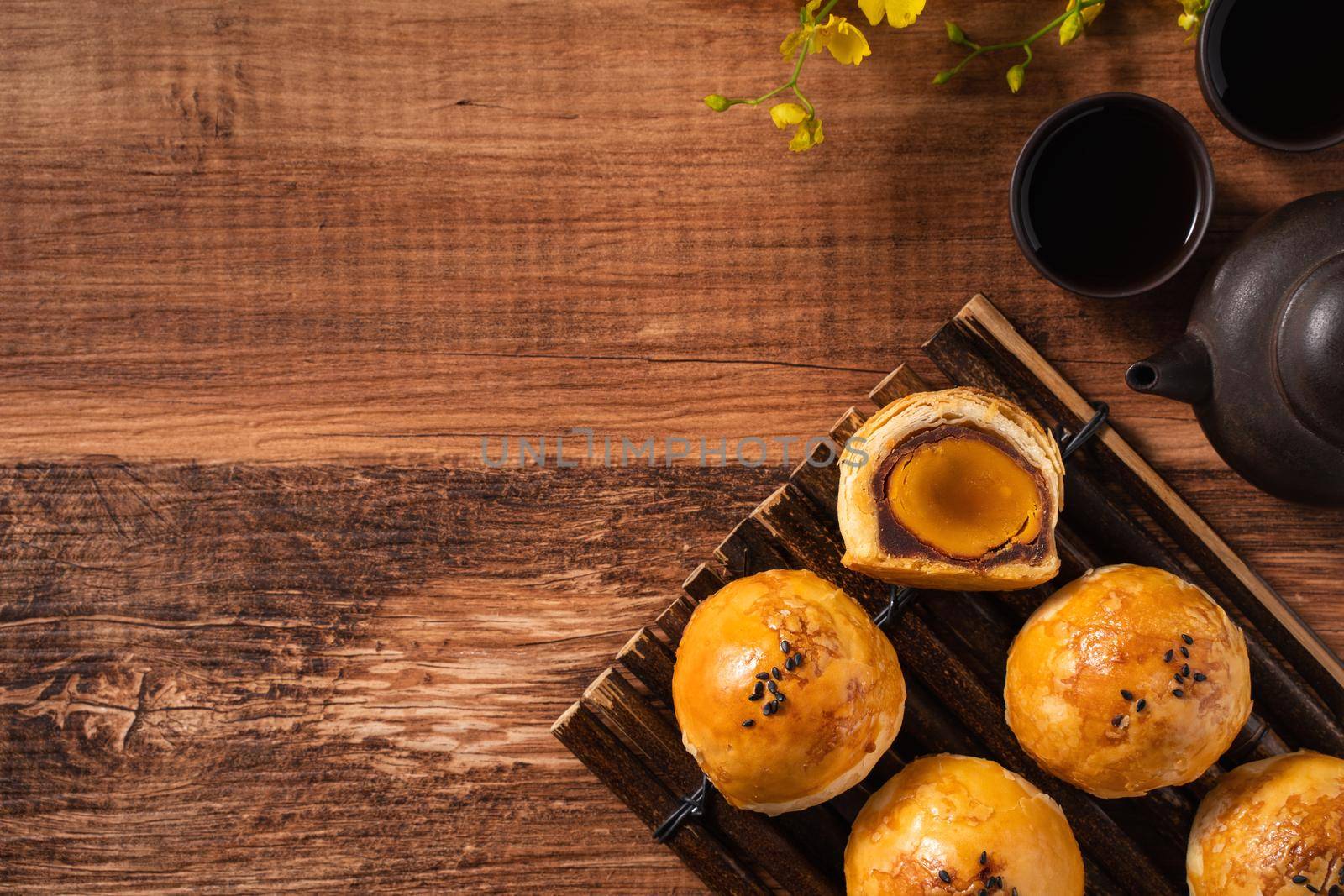 Close up of Moon cake yolk pastry, mooncake for Mid-Autumn Festival holiday on wooden table background