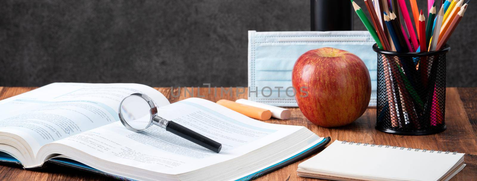Back to school student design concept, close up of stationery over wooden table background with copy space.