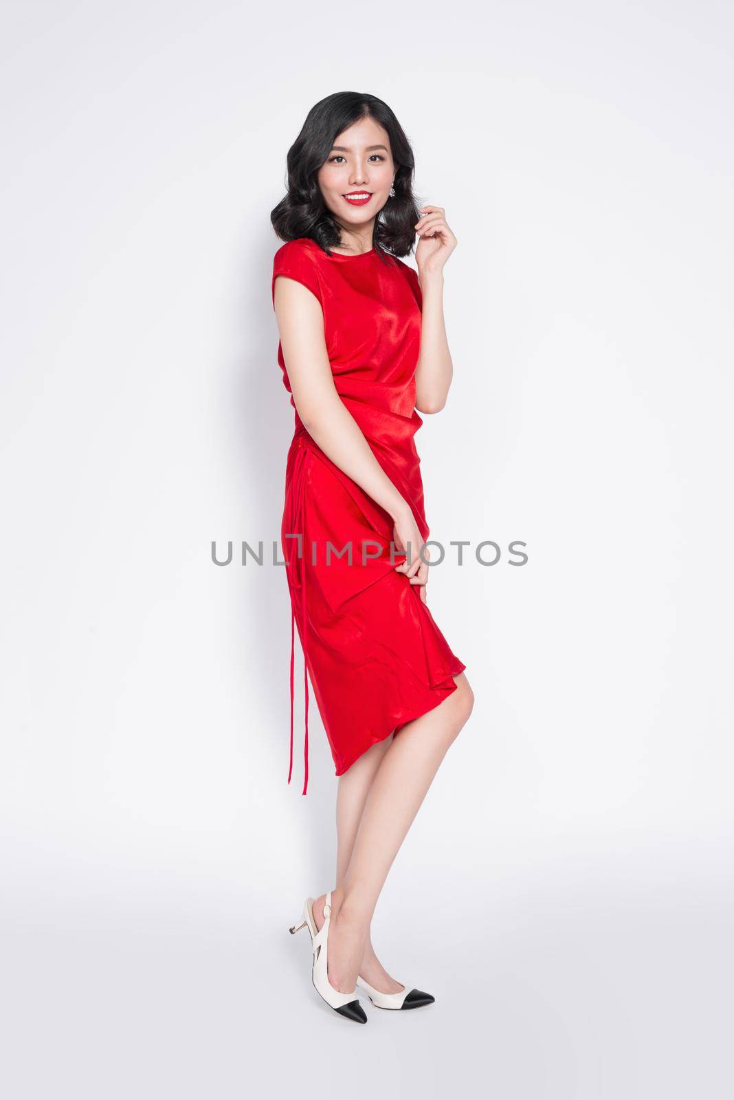 Amazing luxury asian woman in stylish red party dress