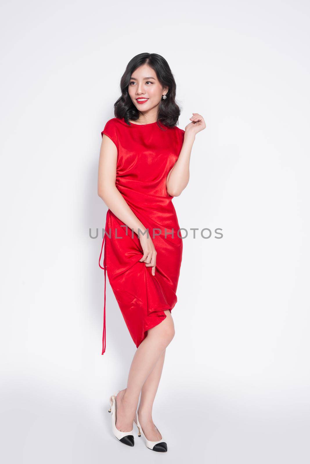 Full length of amazing luxury asian woman in stylish red party dress