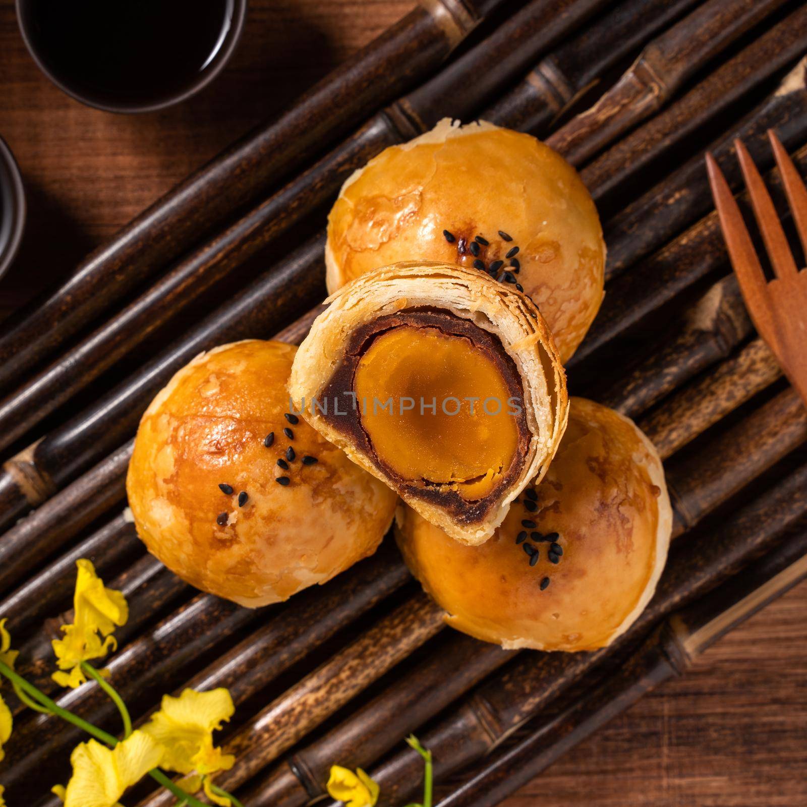 Moon cake yolk pastry for Mid-Autumn Festival holiday. by ROMIXIMAGE