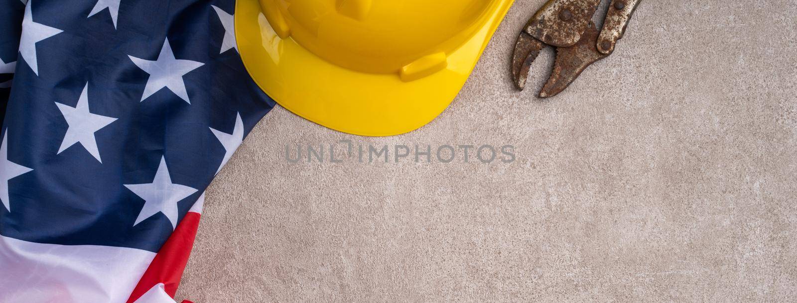 Top view design concept of American Labor Day with working tools. by ROMIXIMAGE