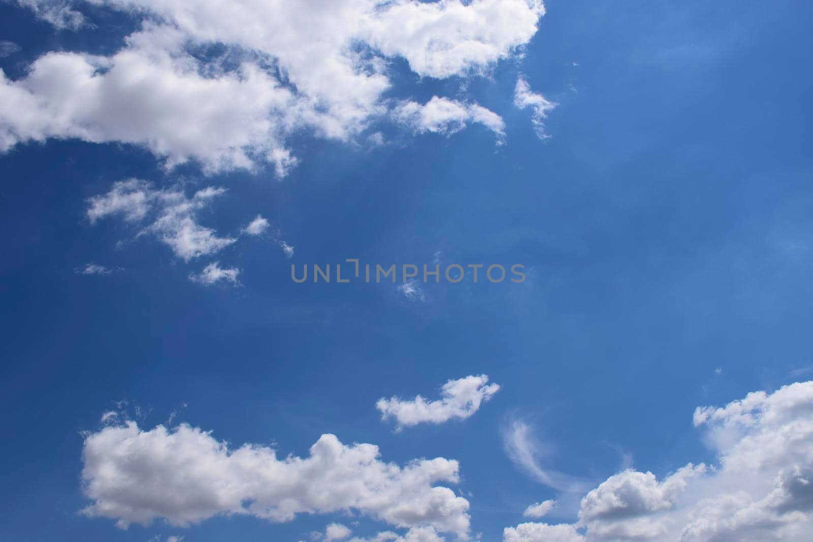 Beautiful blue sky with clouds background. Sky with clouds weather nature clouds and blue sky with sun. Aerial sky and clouds background.