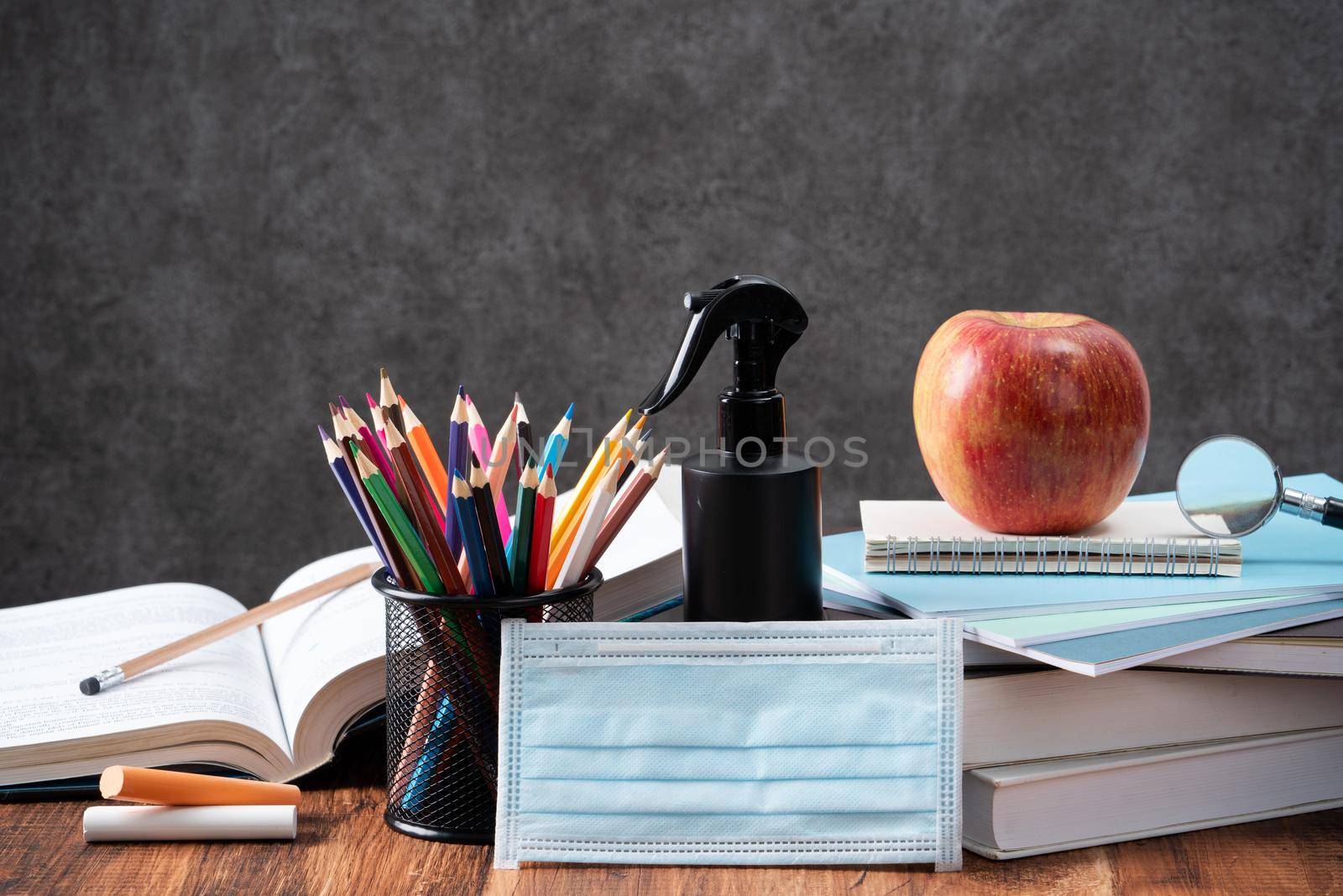 Back to school design concept with stationery over wooden table background. by ROMIXIMAGE
