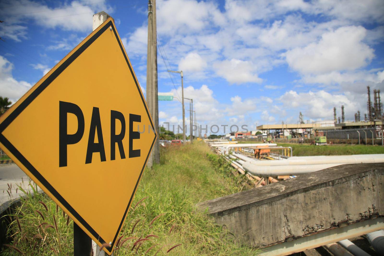 camacari, bahia, brazil - august 24, 2021: view of a traffic sign next to the Braskem company's factory in the industrial hub of the city of Camacari.