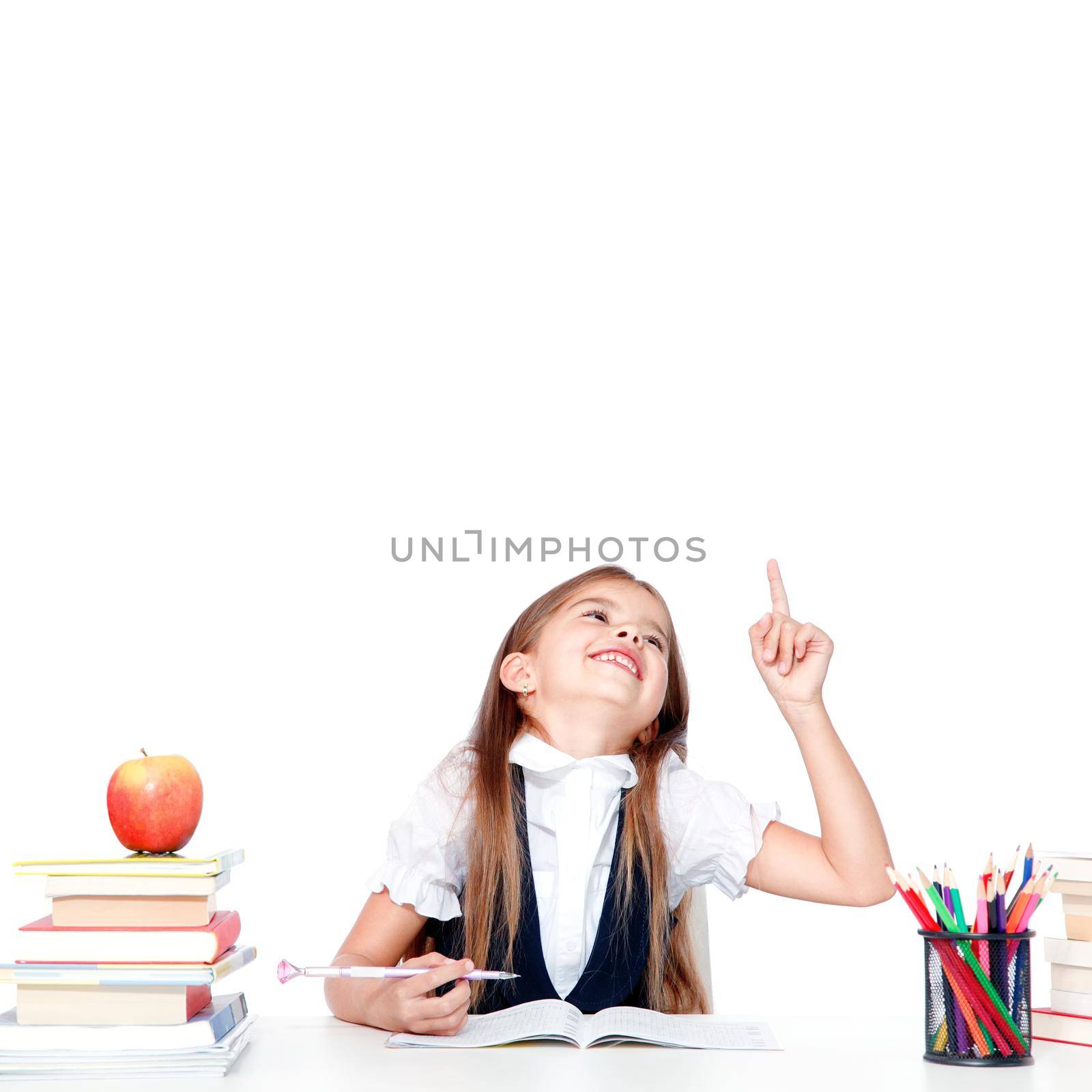 Happy and cute teen schoolgirl raising hand in classroom by Taut