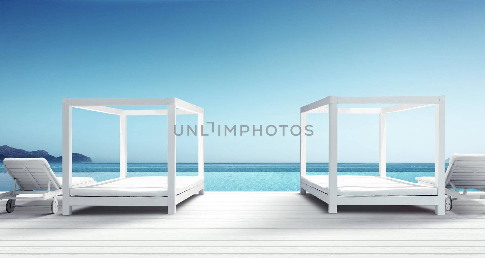 Wooden deck chairs on sandy beach near sea. Holiday background.